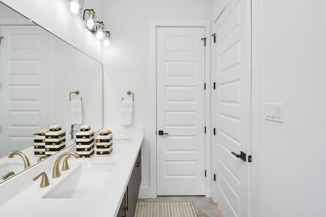 full bathroom featuring a sink and double vanity