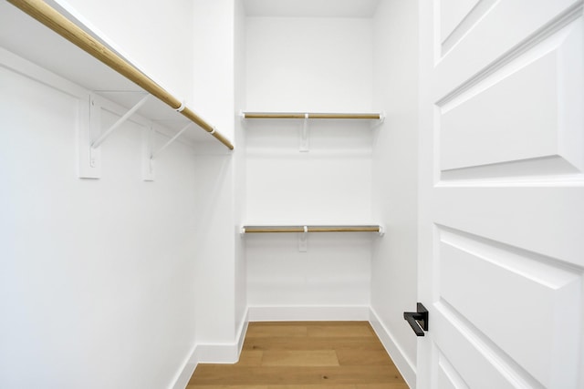 spacious closet with light wood-style floors