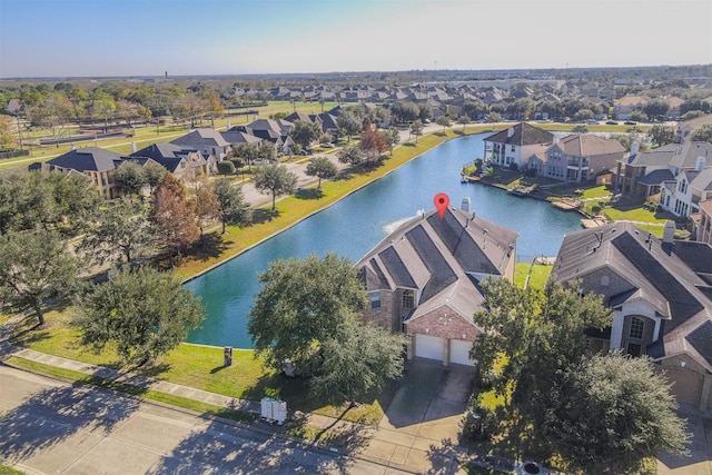 aerial view featuring a water view and a residential view