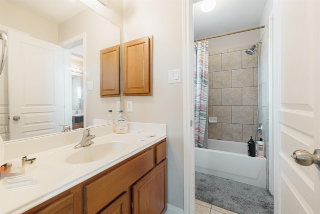 bathroom with tile patterned flooring, shower / bath combo, and vanity