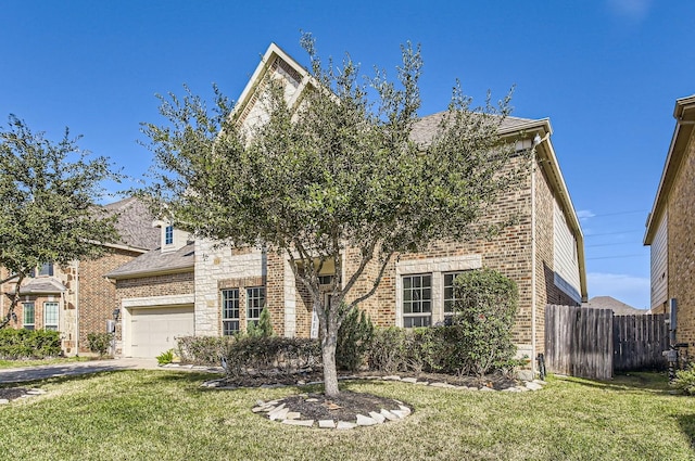 obstructed view of property featuring an attached garage, brick siding, a front yard, and fence