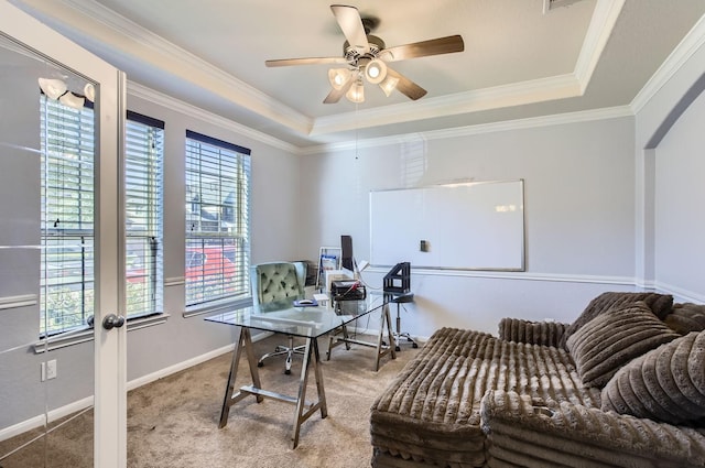 office space featuring a ceiling fan, carpet flooring, crown molding, and baseboards