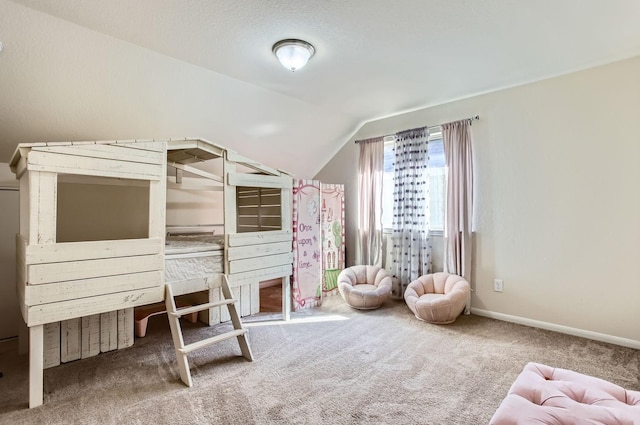 unfurnished bedroom featuring lofted ceiling, carpet flooring, and baseboards