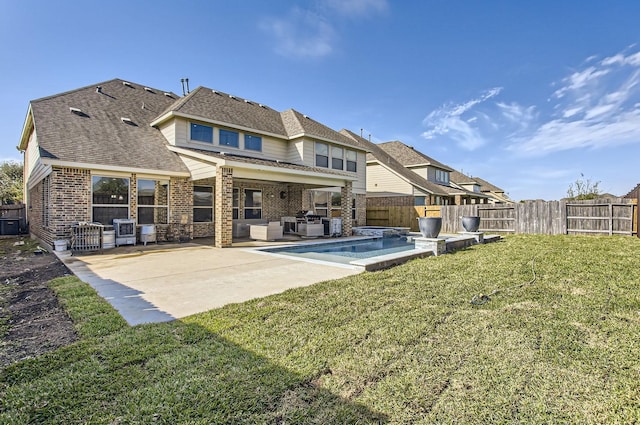 back of property featuring a patio, a fenced in pool, a fenced backyard, brick siding, and a lawn