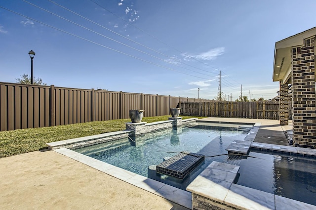 view of swimming pool featuring a patio area and a fenced backyard