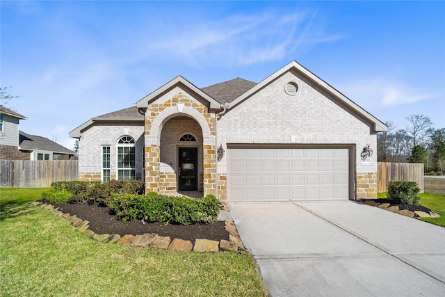 view of front of home featuring a garage, fence, concrete driveway, and brick siding