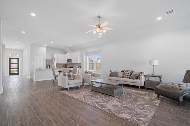 living area with ceiling fan, wood finished floors, visible vents, and recessed lighting