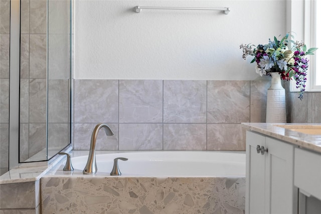 bathroom featuring a bath and vanity