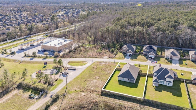 bird's eye view with a residential view and a view of trees