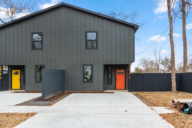 view of front of property featuring fence and a gate