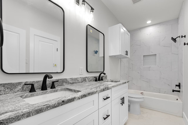 bathroom with toilet, double vanity, washtub / shower combination, and a sink