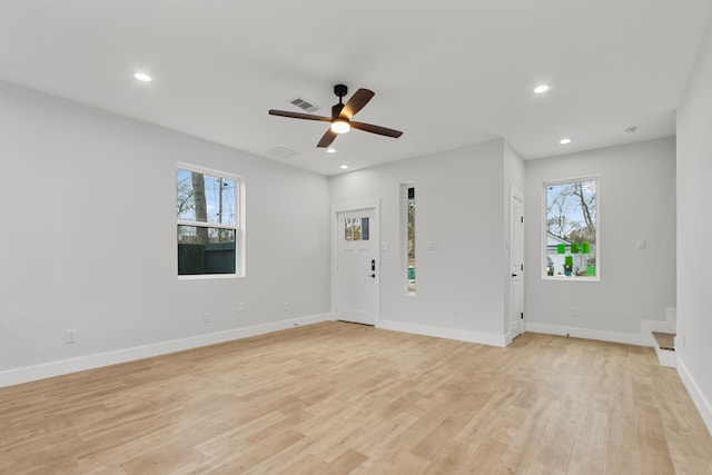 interior space featuring light wood-type flooring, baseboards, visible vents, and recessed lighting