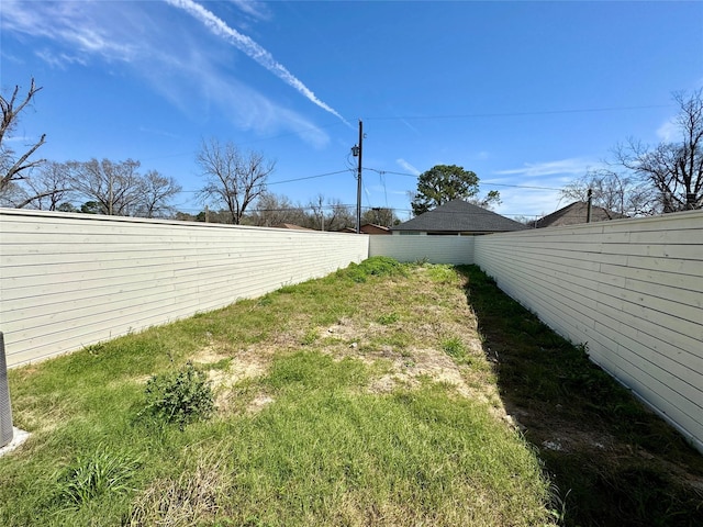 view of yard featuring a fenced backyard