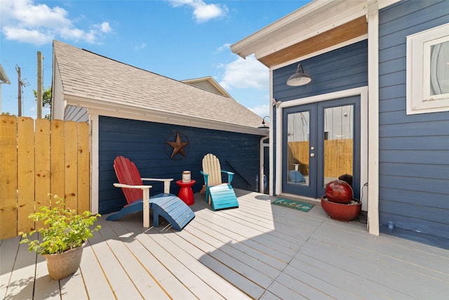 wooden terrace with french doors and fence