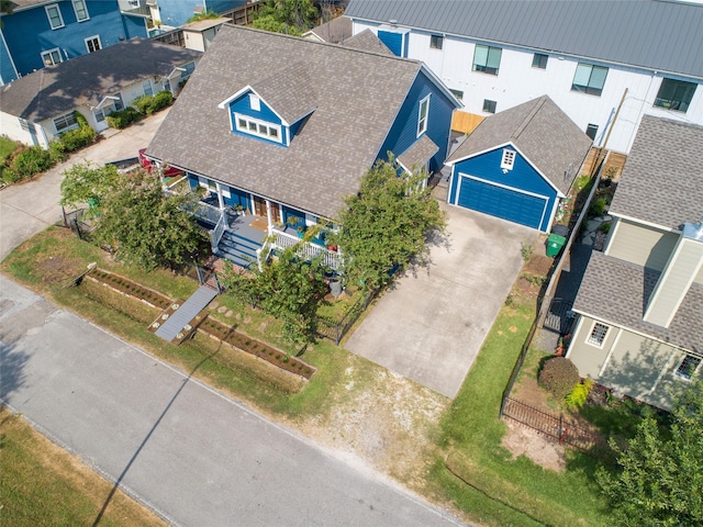 birds eye view of property with a residential view