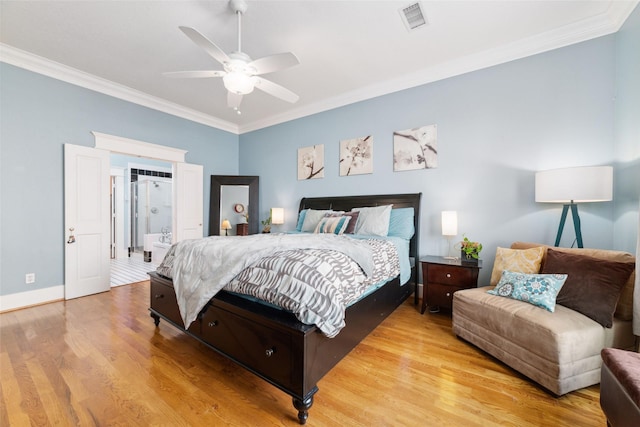 bedroom with crown molding, visible vents, ensuite bathroom, a ceiling fan, and light wood-type flooring