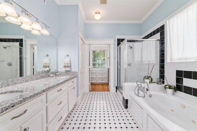 bathroom with double vanity, a shower stall, ornamental molding, and a sink