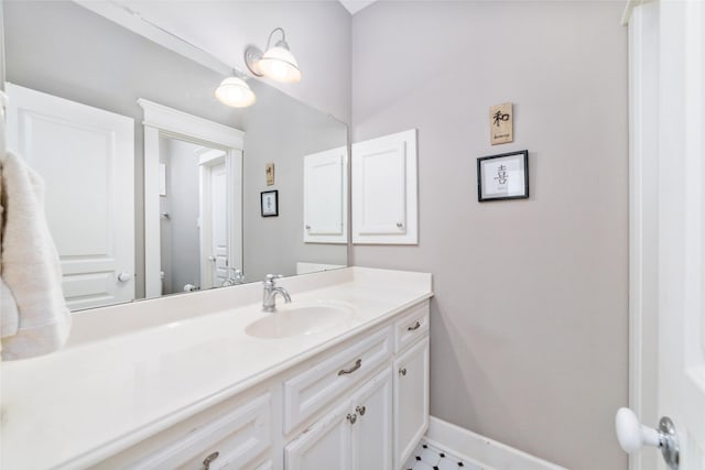 bathroom featuring vanity and baseboards