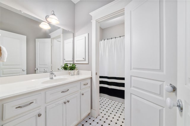 full bathroom with curtained shower and vanity