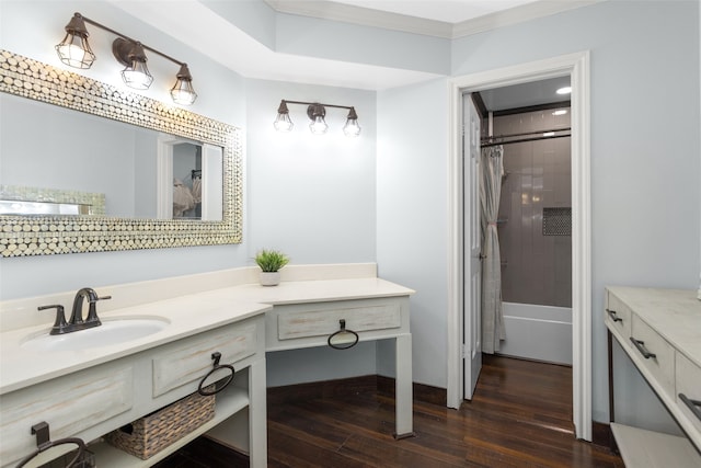 full bath with ornamental molding, shower / bath combo with shower curtain, wood finished floors, and vanity