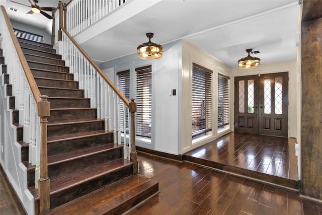 entryway with visible vents, baseboards, wood-type flooring, stairway, and french doors