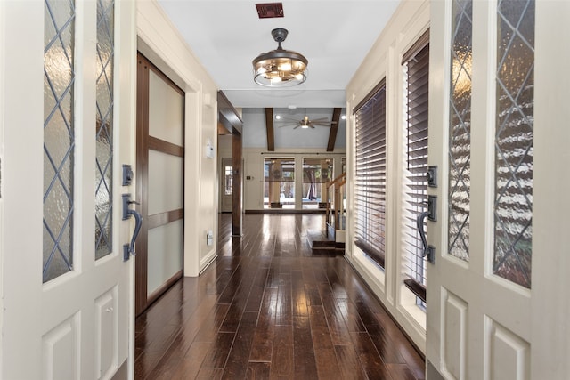 corridor with french doors and dark wood-style flooring