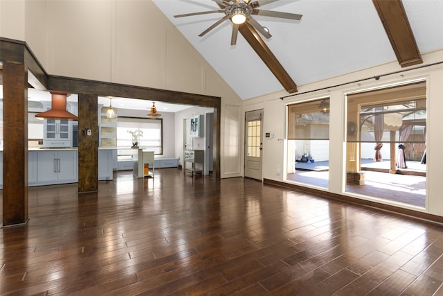 unfurnished living room featuring ceiling fan, beamed ceiling, dark wood-style flooring, and high vaulted ceiling