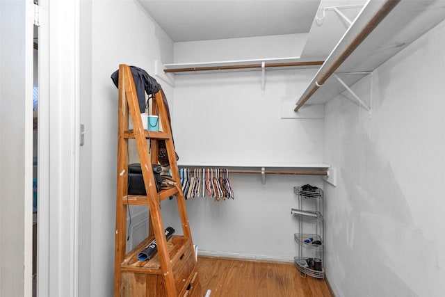 spacious closet with wood finished floors