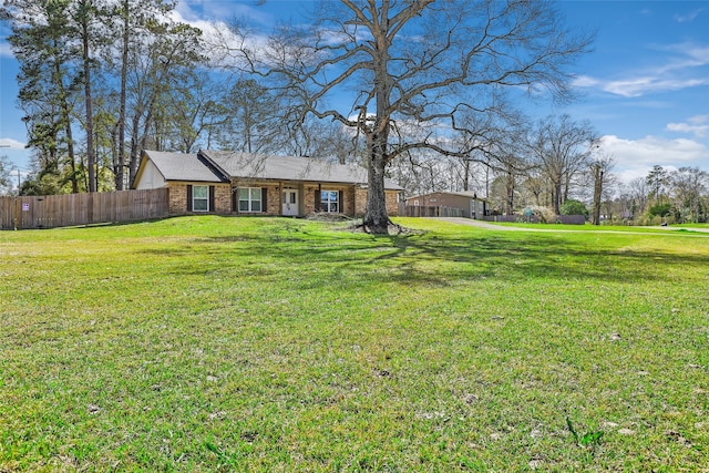 view of yard with a garage and fence