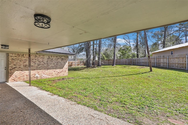 view of yard with a fenced backyard