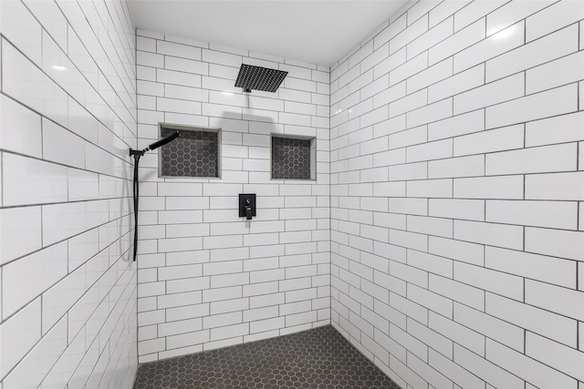 full bathroom with tiled shower