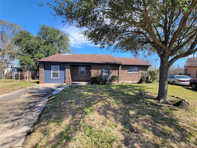 ranch-style house featuring a front lawn, fence, and brick siding