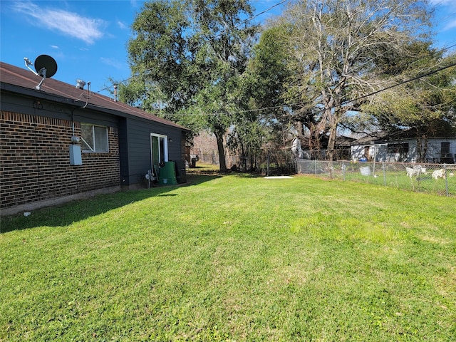 view of yard featuring fence