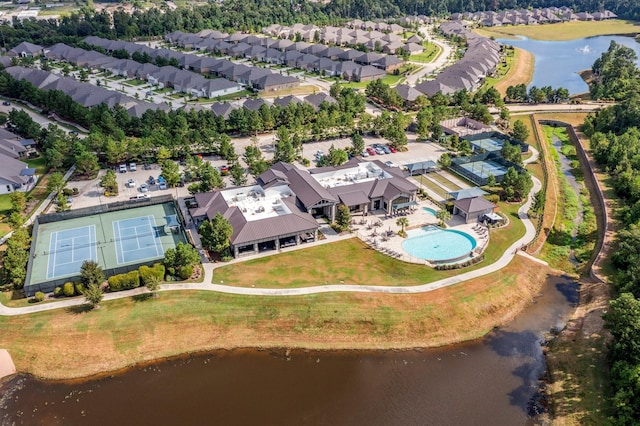 birds eye view of property featuring a residential view and a water view