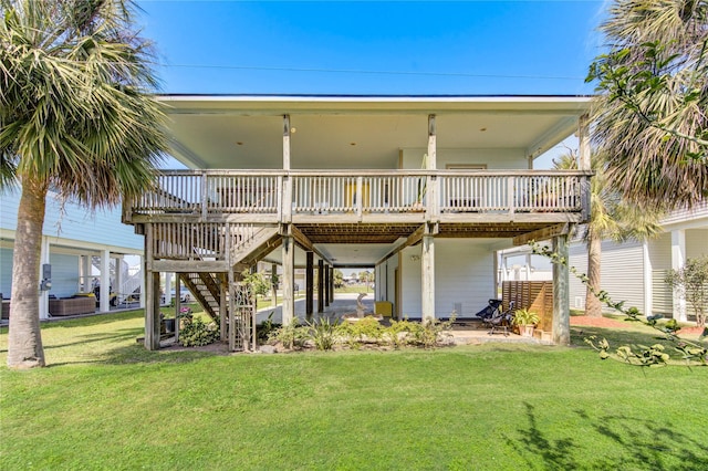 back of house featuring stairway, a wooden deck, and a yard