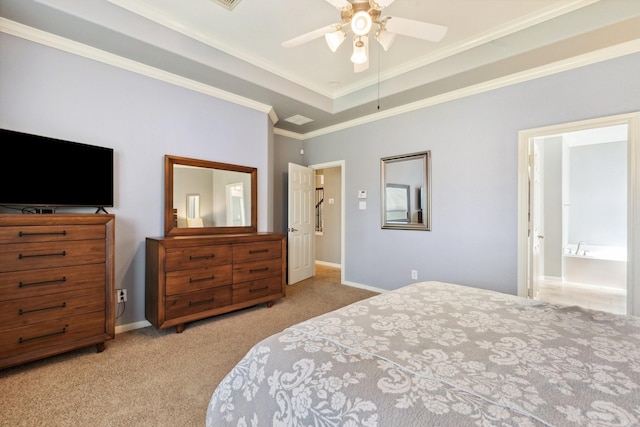 carpeted bedroom featuring a raised ceiling, crown molding, baseboards, and ceiling fan