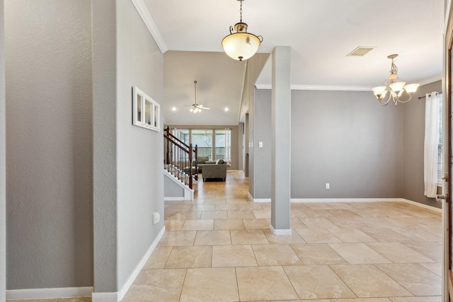 foyer entrance featuring stairs, ornamental molding, visible vents, and baseboards