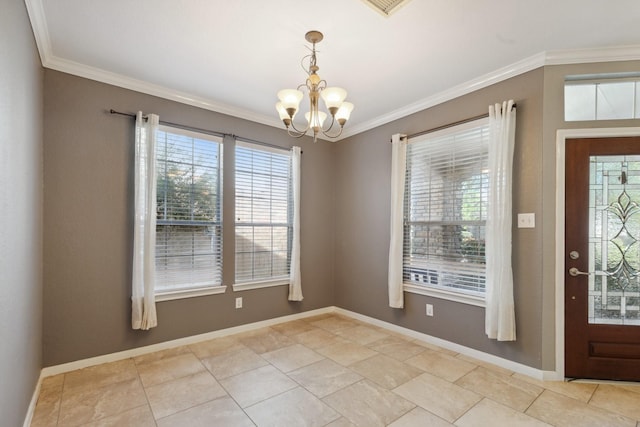 entryway with baseboards, a chandelier, and crown molding