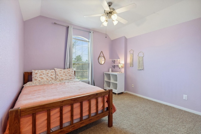 bedroom featuring lofted ceiling, carpet flooring, and baseboards