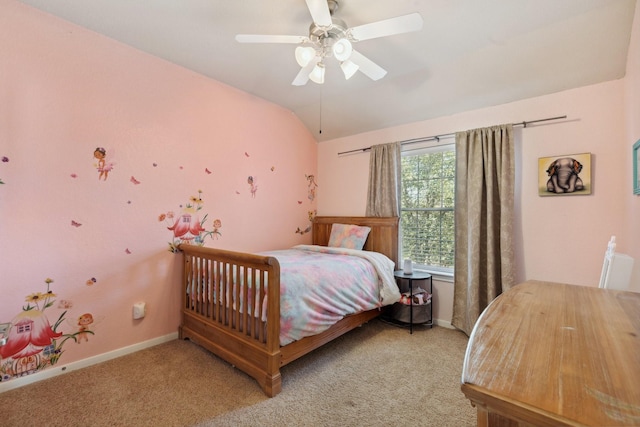 bedroom with carpet floors, vaulted ceiling, baseboards, and a ceiling fan