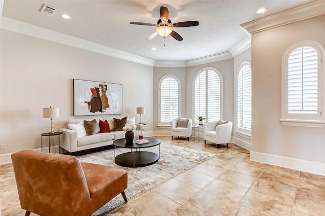 living room featuring ornamental molding, plenty of natural light, visible vents, and baseboards