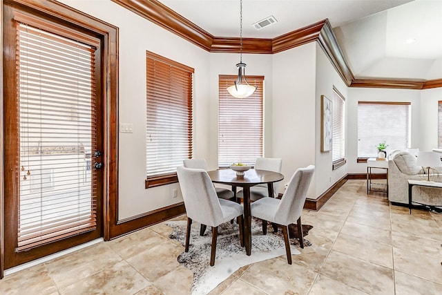 dining area featuring light tile patterned floors, baseboards, visible vents, and crown molding