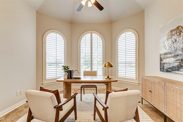 office featuring ceiling fan, lofted ceiling, and baseboards