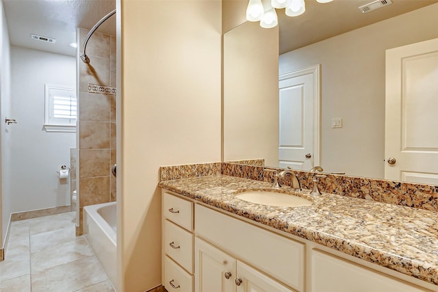 full bathroom featuring toilet, tile patterned flooring, vanity, and visible vents