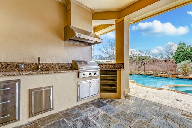 view of patio / terrace featuring a fenced in pool, a grill, fence, exterior kitchen, and a sink