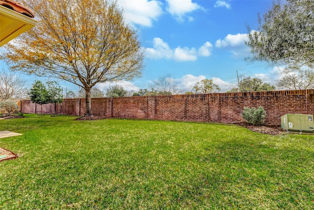 view of yard with a fenced backyard