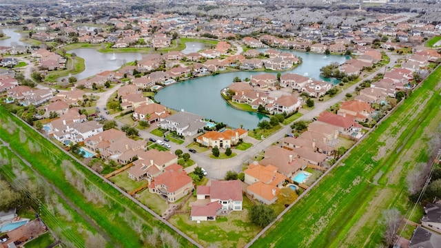 aerial view featuring a water view and a residential view