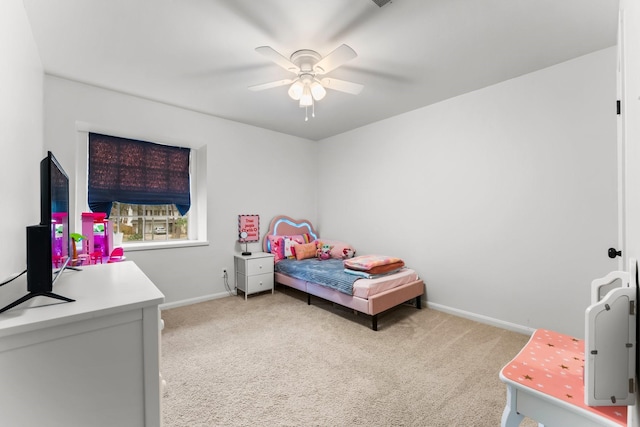 bedroom featuring light carpet, ceiling fan, and baseboards