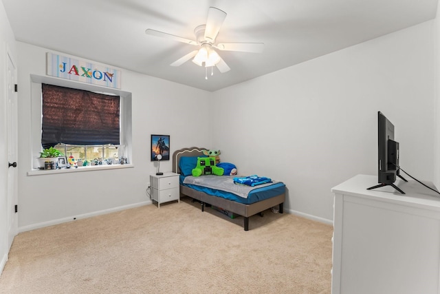 bedroom featuring carpet floors, baseboards, and a ceiling fan