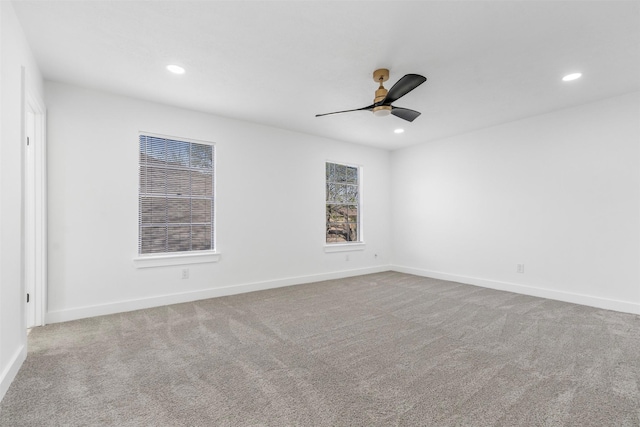 unfurnished room with recessed lighting, carpet flooring, and baseboards